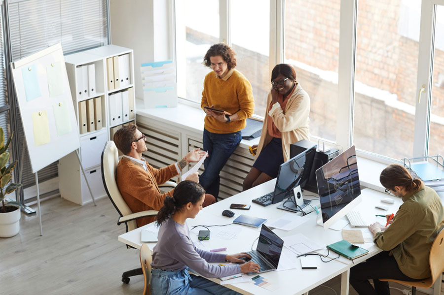 Employees around desk